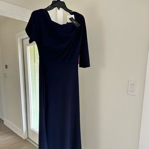 Beautiful navy blue mermaid features an asymmetric off one shoulder neckline.